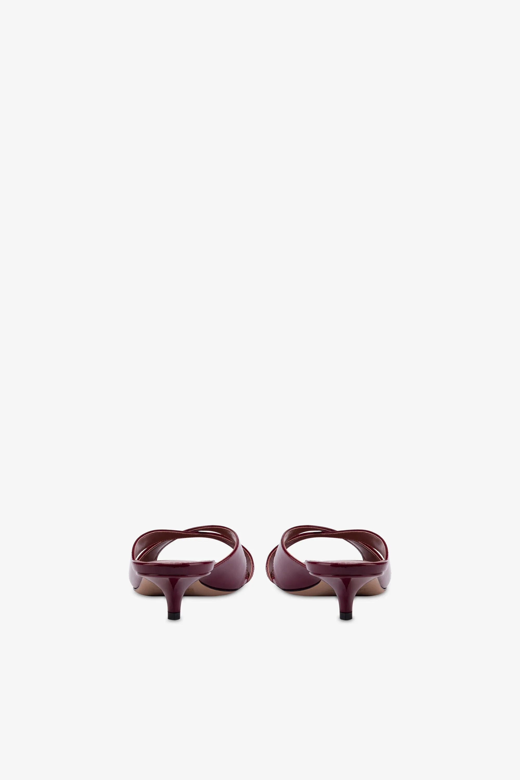 Mules in patent rouge noir leather