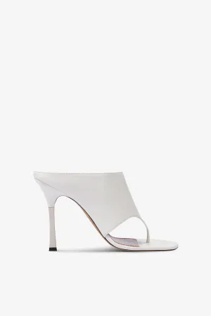 Mules in white leather