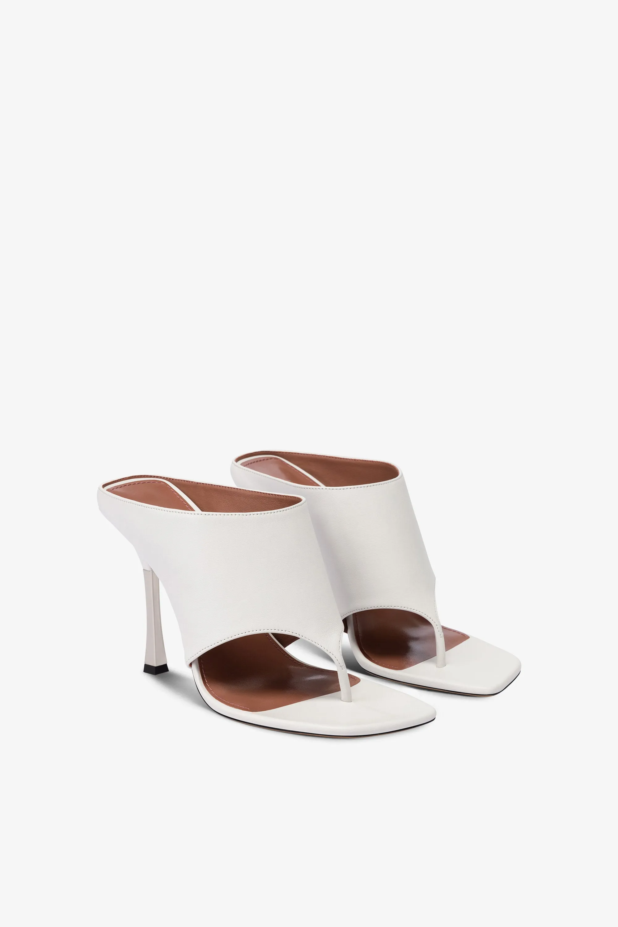 Mules in white leather